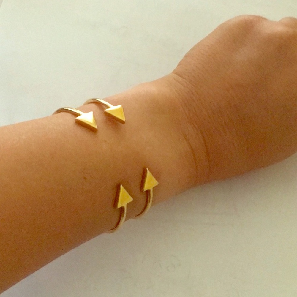 Gold tone arrow bangle